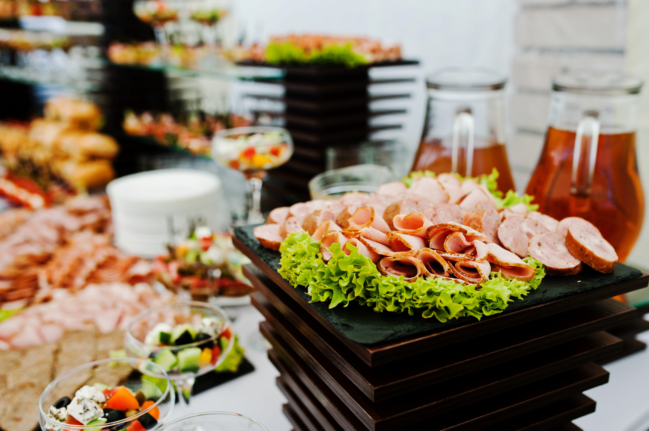 Buffet table of reception with burgers, cold snacks, meat and salads